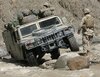 1200px-Humvee_in_difficult_terrain.jpg